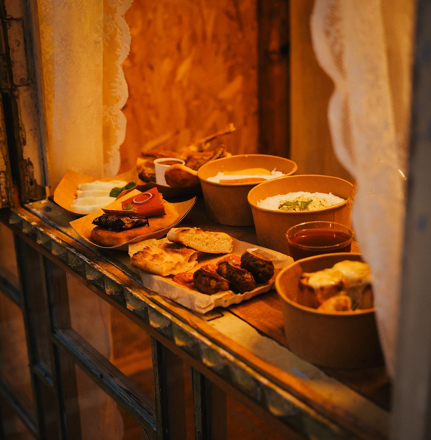Megrelian feast spread on a rustic ledge